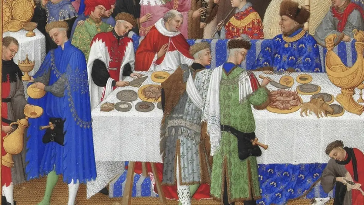 中世フランスの王族ベリー公ジャン1世の豪華な新年の晩餐会を描いた、パブリックドメインの装飾写本。ランブール兄弟による細密画で、当時の貴族の華やかな服装や、船の形をした金細工の塩入れ「ネフ」、トレンチャーと呼ばれる皿代わりのパンなどが並ぶ食卓の様子が詳細に描写されている